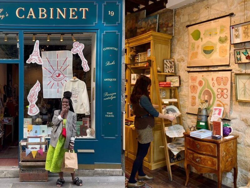 This is an image of an amazing little crafty shop in Paris with a bunch of fun little pieces in the window. To the right is someone inside the store looking at some ceramics.