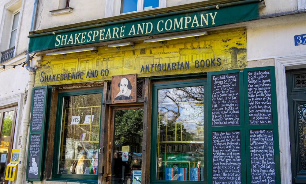 This is an image of an iconic book shop called Shakespeare and Company in Paris. Its branding is yellow and green.