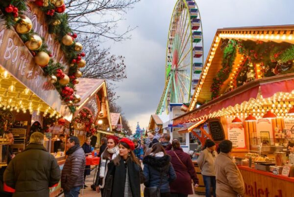 This is an image of a Christmas market with lights, decorations and more.