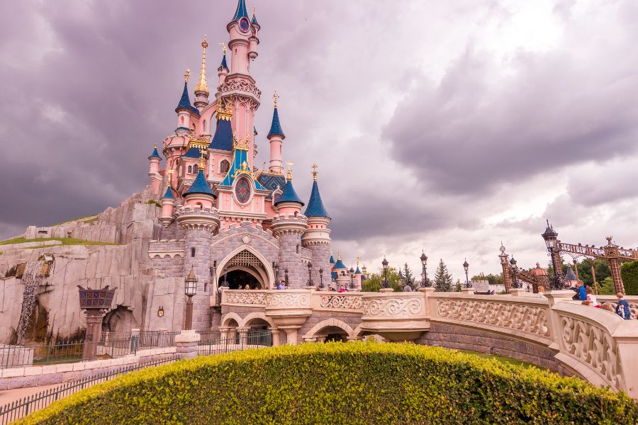 This is an image of the classic Disneyland Castle on a hill.