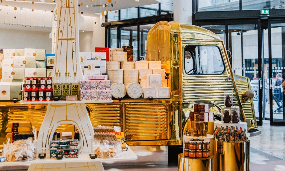 This is an image of a gourmet department store with some specialty foods on an Eiffel Tower display.