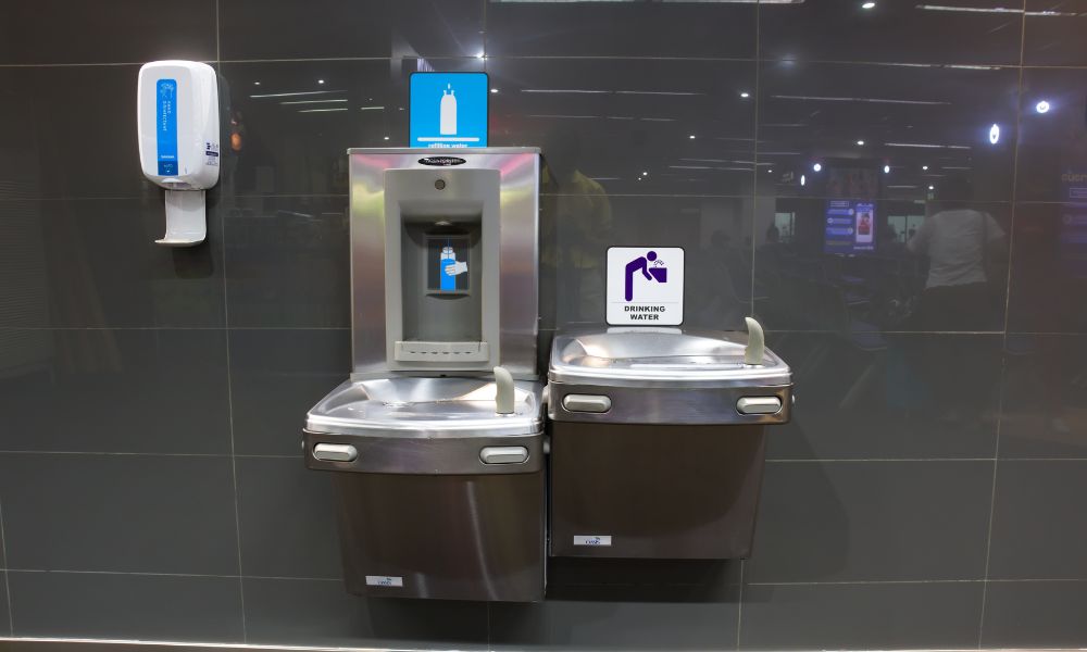 This is an image of a water fountain tap connected to the wall where you can top up your water.