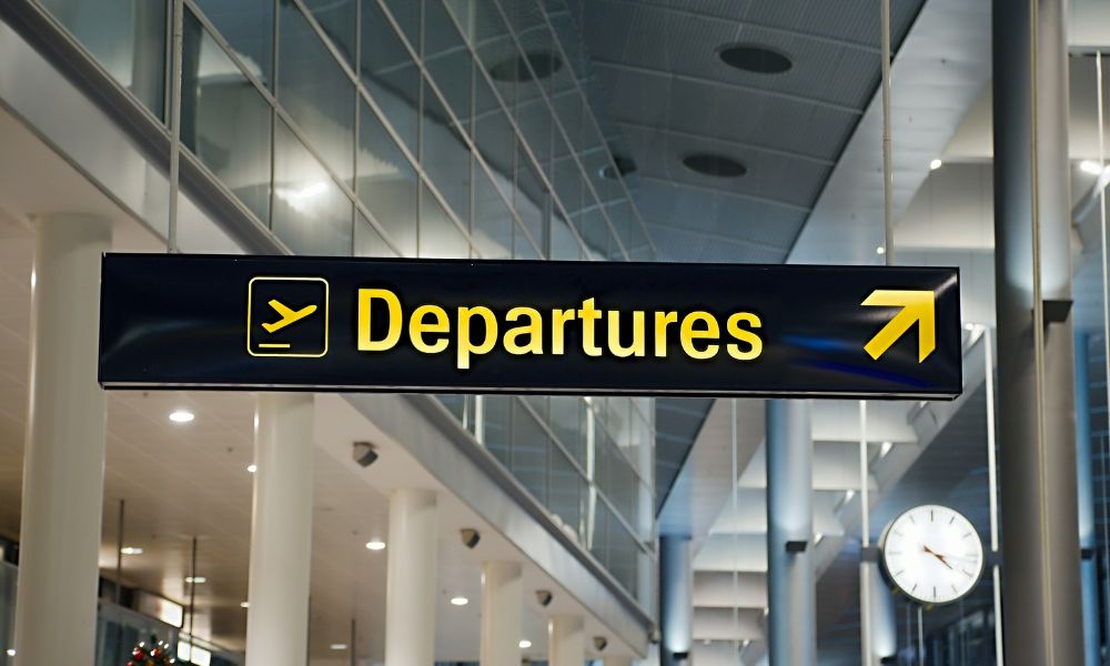 This is an image of a big sign that says 'departures' on it.
