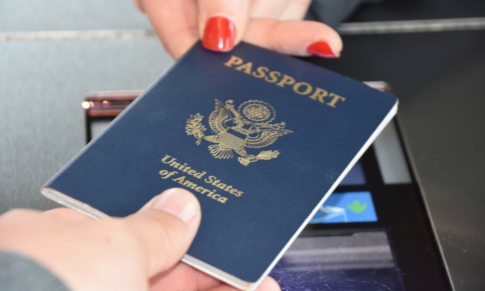 This is an image of someone passing an American passport through border security.