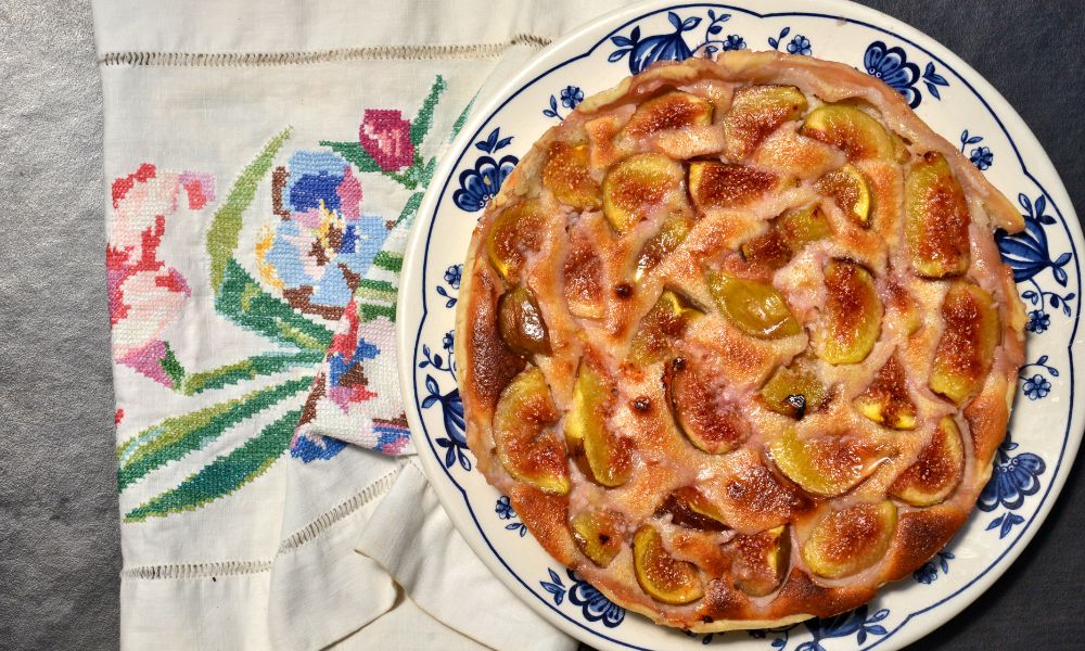 This is an image of a fig tarte with fresh figs baked into the top of a crunchy / soft cake.