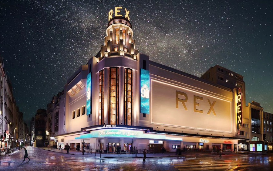 This is an image of the outside of a cool cinema with a starry sky in the background.