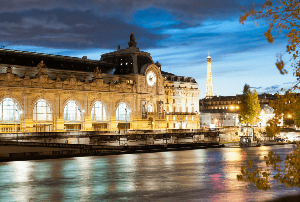 Picture of the exterior of the Musee D'Orsay at night with all the lights on. This is one of the Top Guided Tours of Paris Attractions.