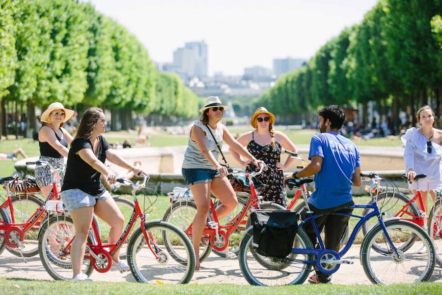 This is an image of a group of adults on a bike tour in Paris.