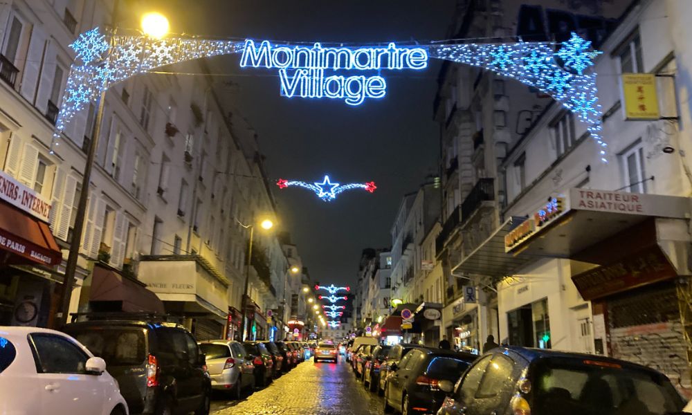 This is an image of a road in Montmartre being lit-up for the holidays.