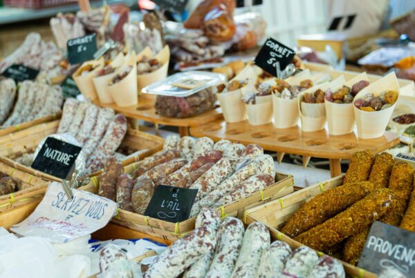 This is an image of a shop displaying a wide variety of different French deli meats.