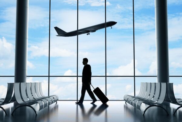This is an image of a plane taking off outside and airport seating inside.
