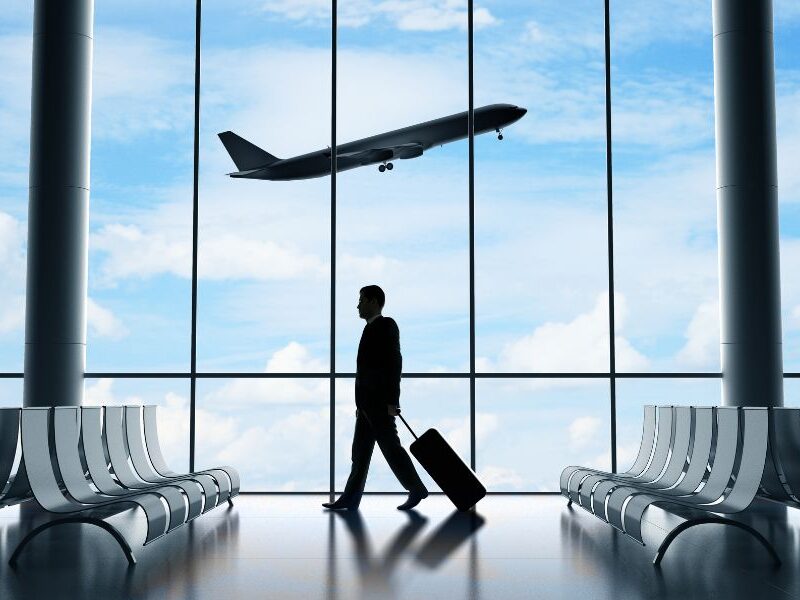 This is an image of a plane taking off outside and airport seating inside.