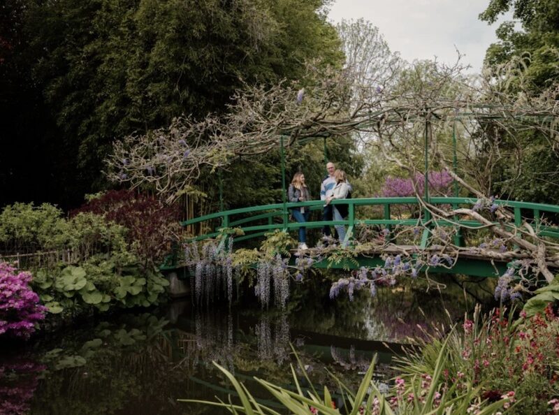 This is an image of a small group of people on a bridge in Monet's Giverny Gardens.